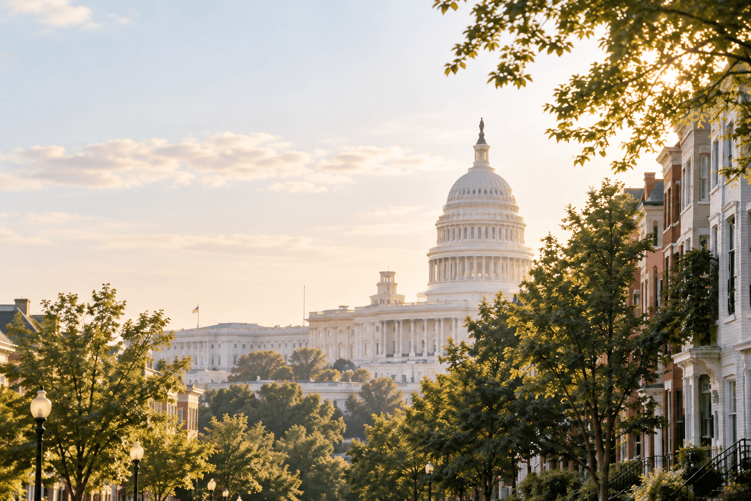 U.S. Capitol dome seen from a tree-lined DC rowhouse street
